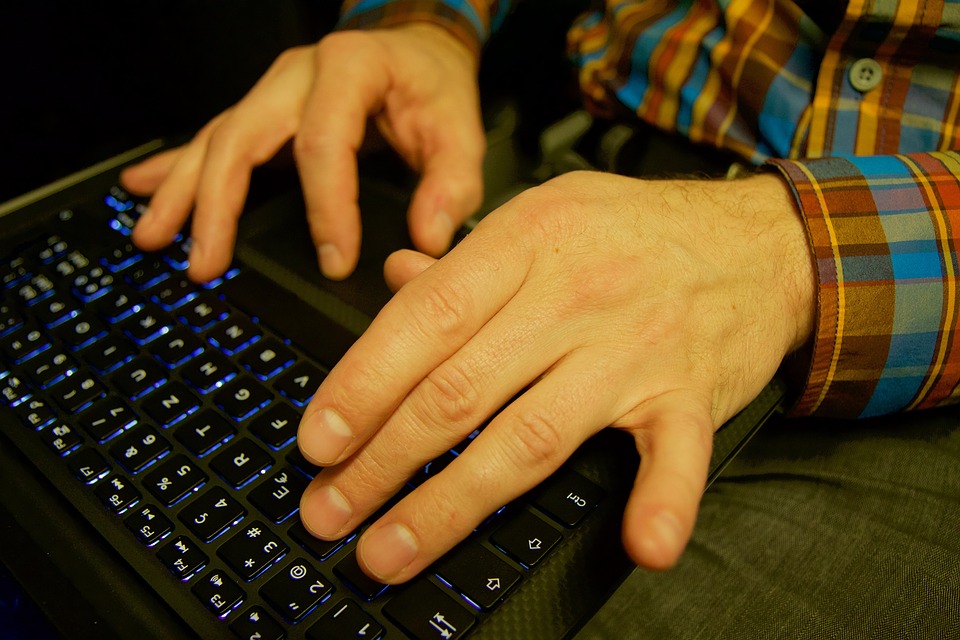 typing on laptop